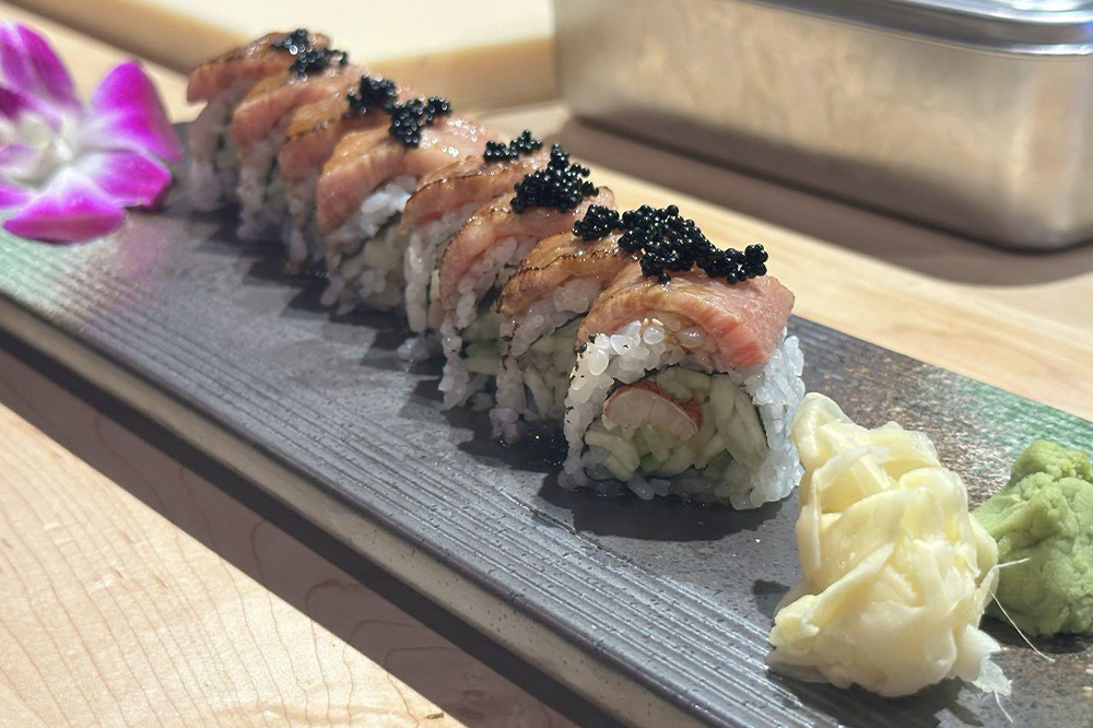 Seared tuna sushi roll topped with caviar
